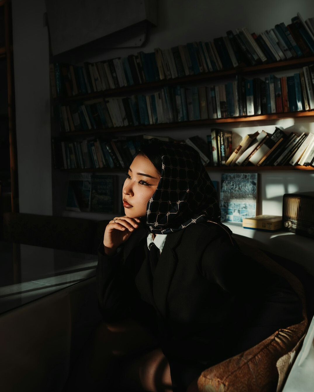 detective reading book in library