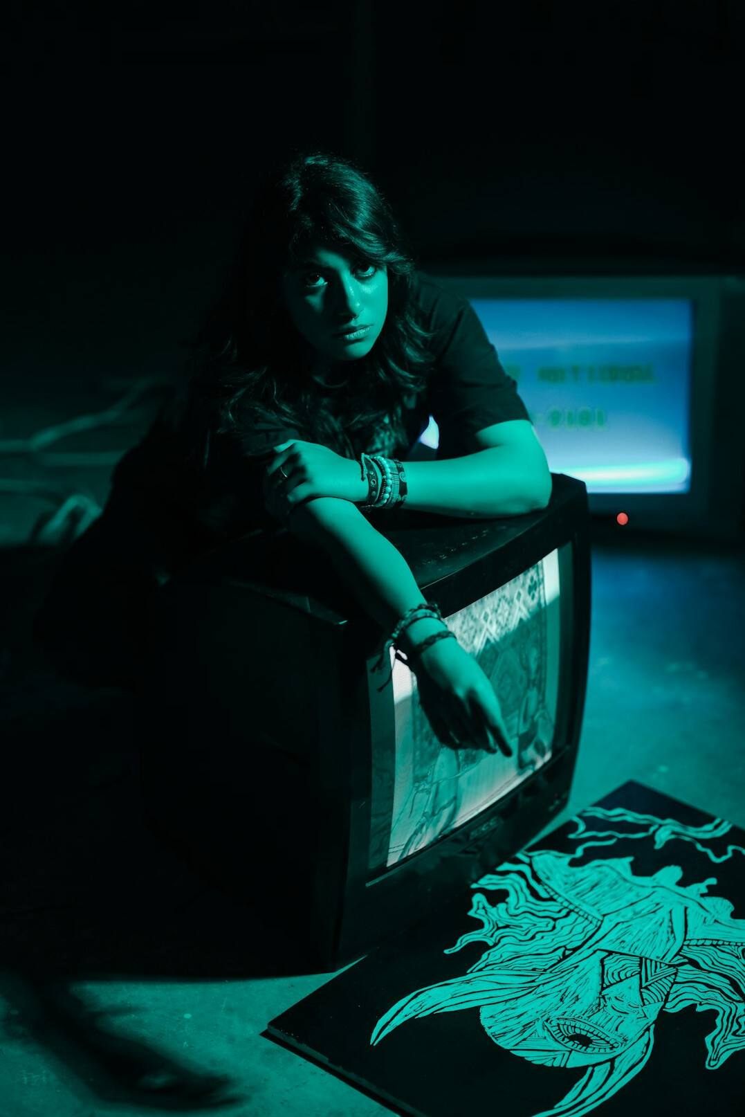 author sitting in dark room writing