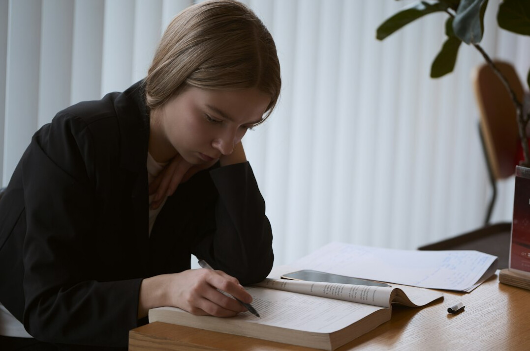 writer at desk with notebook
